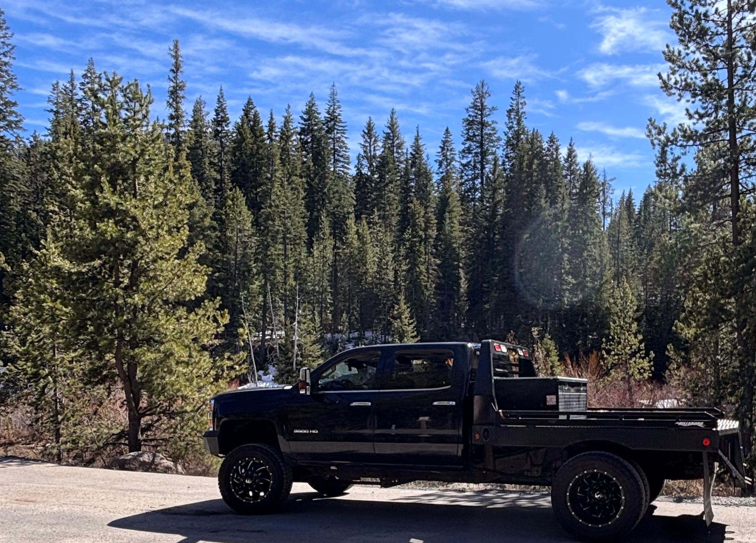 Pickup truck on forest road in Oregon near Redmond for vehicle inspection service